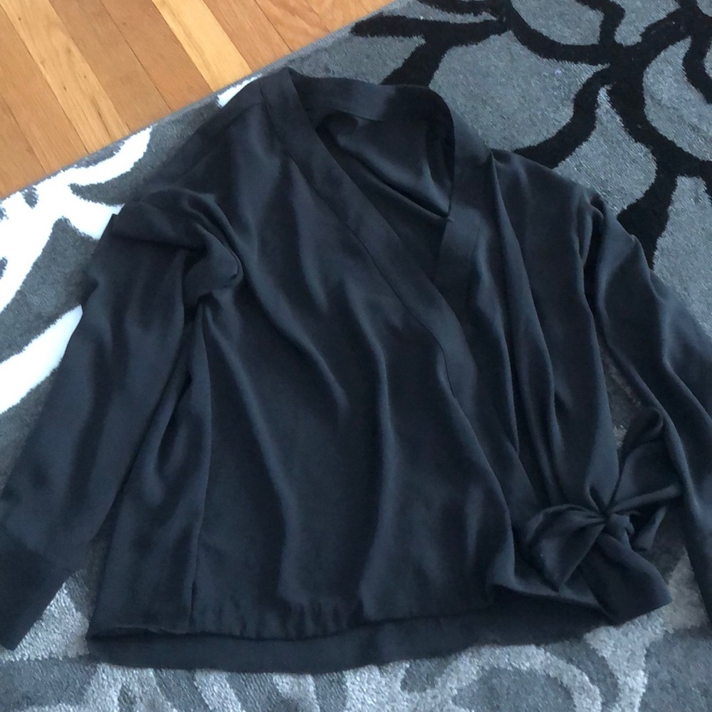 Black, v-neck, translucent blouse with tie.